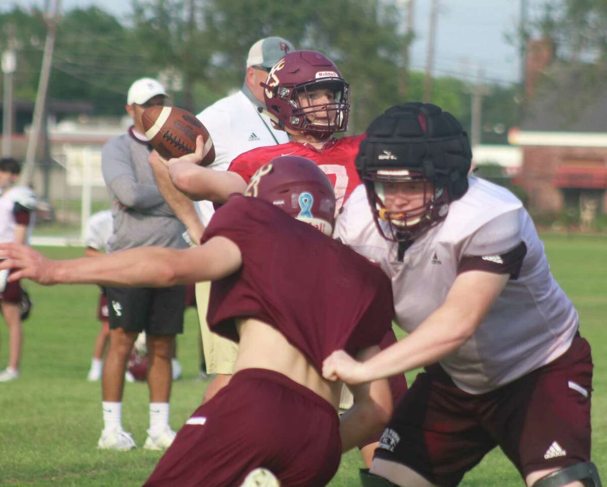 Quarterback Teague Sedtal looks downfield for an open receiver during a spring practice. Sedtal now prepares for a month of 7-on-7 activity in June, scheduled for each Tuesday night.