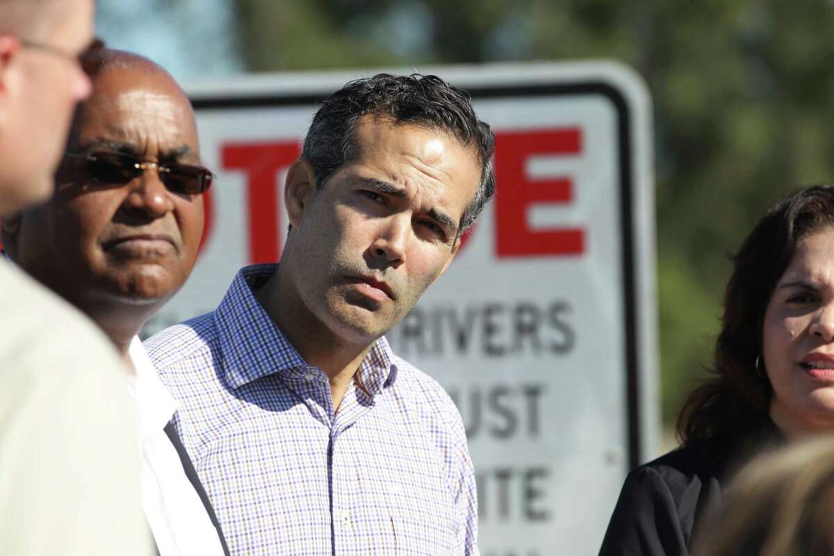 Texas General Land Office Commissioner George P. Bush listens to Executive Director of the Harris County Flood Control District Russell "Russ" Poppe, Harris County Commissioners R. Jack Cagle and Rodney Ellis talk about post-Harvey buyout plans Nov. 16, 2018, in Houston.