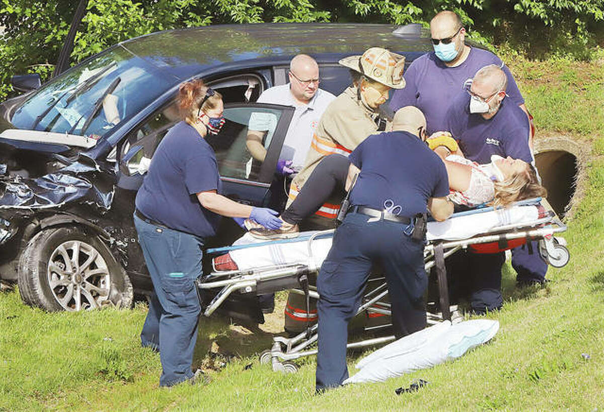 Godfrey firefighters and Lifestar Ambulance paramedics on Tuesday morning remove the driver of a Chevrolet Equinox that crashed into another Equinox on Martin Luther King Boulevard at Northport Drive. Both drivers were taken to local hospitals. Both vehicles, which were only occupied by their drivers, suffered extensive damage.