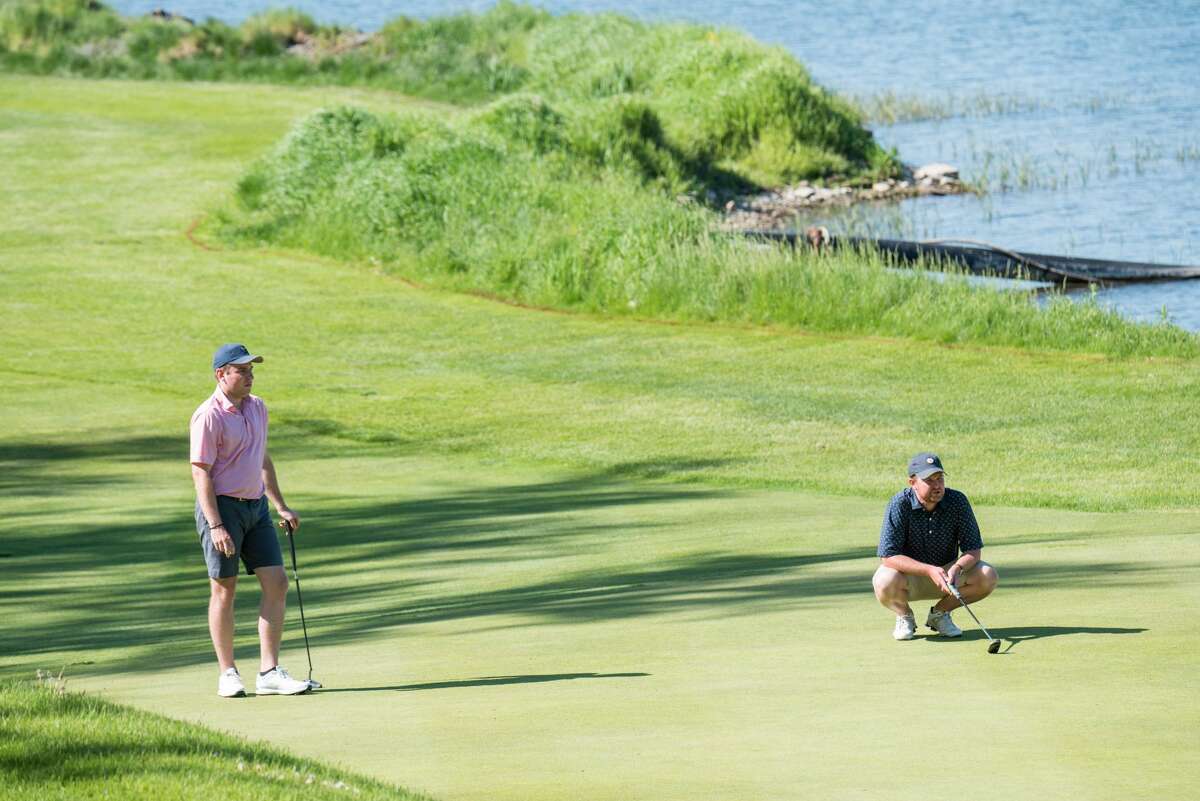 Michael Dwyer, left, and Mike Stopera study their putts Monday, May 24, 2021, in the final round of the New York State Golf Association Four-Ball Championship at Leatherstocking Golf Course in Cooperstoown. (Dan Thompson/NYSGA) Final Round of the 2021 NYS Men's Amateur & Senior Amateur Four-Ball Championships at Leatherstocking Golf Course in Cooperstoown, N.Y. on May 24, 2021.