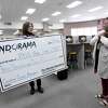 Indorama Ventures' Kim Hoyt surprises Port Neches - Groves High School teacher Candice Curran with a grand prize award of $3,000 for her STEM Innovation Grant project proposal Wednesday. Photo made Wednesday, May 19, 2021 Kim Brent/The Enterprise