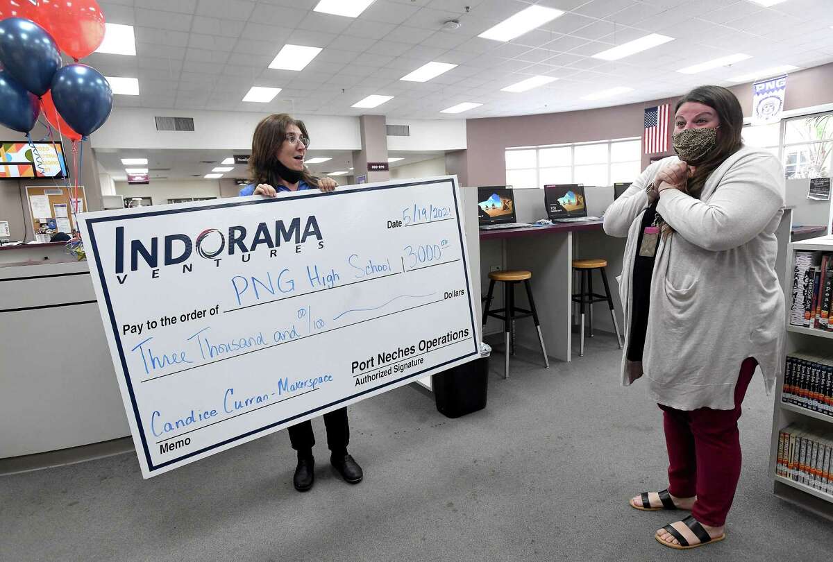 Indorama Ventures' Kim Hoyt surprises Port Neches - Groves High School teacher Candice Curran with a grand prize award of $3,000 for her STEM Innovation Grant project proposal Wednesday. Photo made Wednesday, May 19, 2021 Kim Brent/The Enterprise