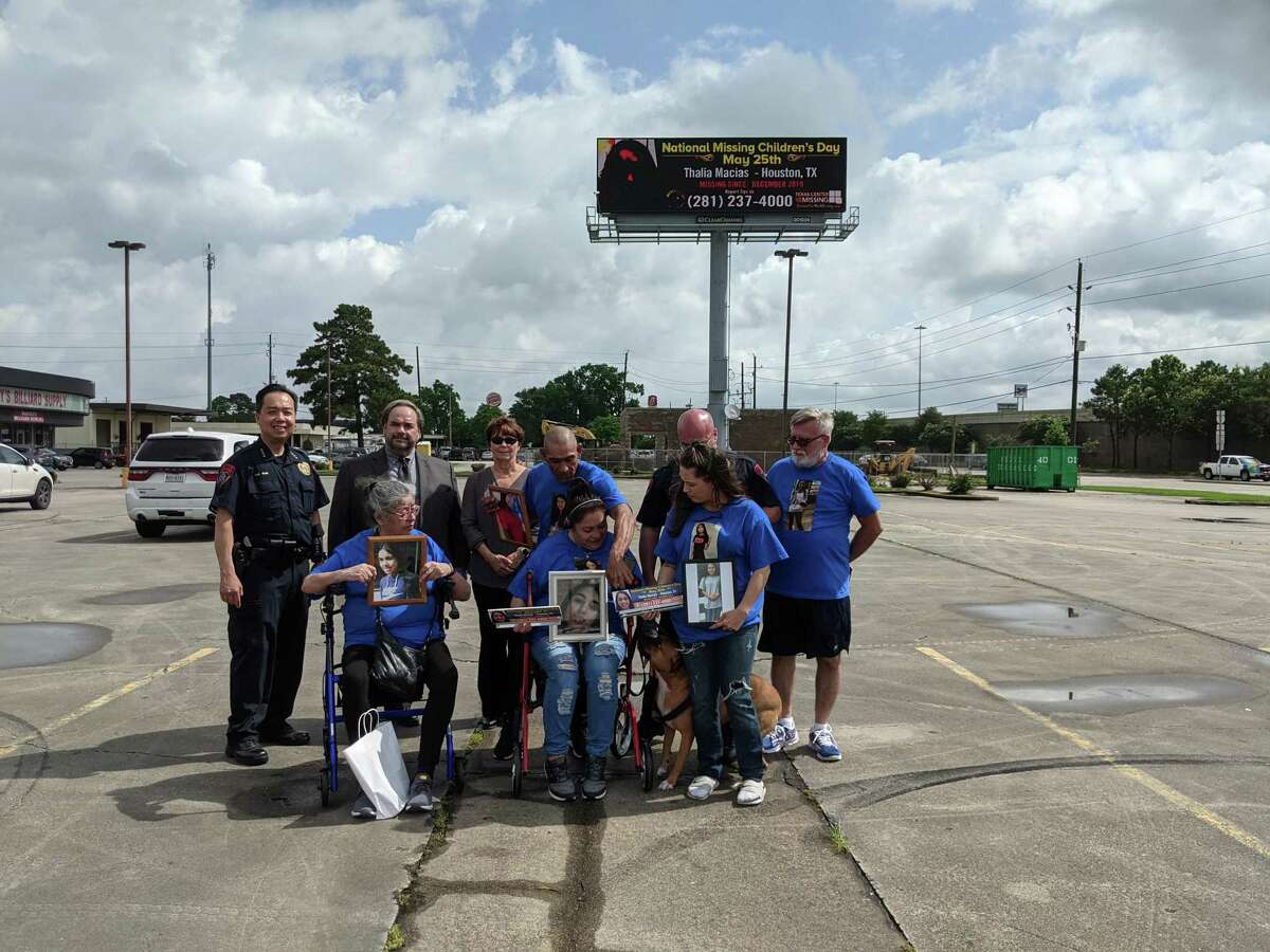 A digital billboard featuring missing Katy teen Thalia Macias was unveiled on Tuesday. Shown here are Henry Gaw, Chief of Police, Katy ISD; Lee Vela, VP Public Affairs, Clear Channel Outdoor; Beth Alberts, CEO of Texas Center for the Missing; Ana Escobedo, Thalia’s Aunt; Alma Romero, Thalia’s mother; Hose Romero, Thalia’s father; Frank Muniz, Detective and Training Officer, Katy ISD; and Jayni Dutton, Thalia’s neighbor. The dog is Simba, who was a puppy when Thalia last played with him.