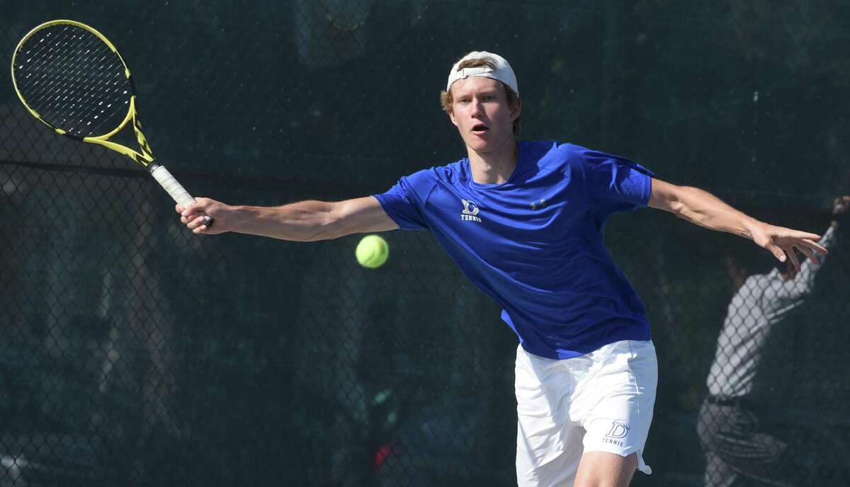 Darien’s Chris Calderwood in action against Staples’ Tighe Brunetti at No. 1 singles during the FCIAC final Tuesday in Wilton.