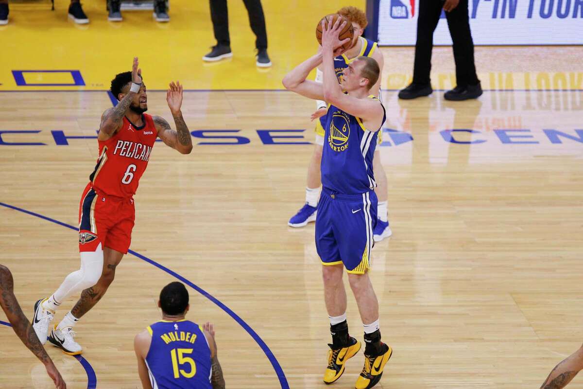 Golden State Warriors forward Alen Smailagic (6) attempt a three-point shot against New Orleans Pelicans guard Nickeil Alexander-Walker (6) in the first quarter of an NBA game at Chase Center, Friday, May 14, 2021, in San Francisco, Calif.