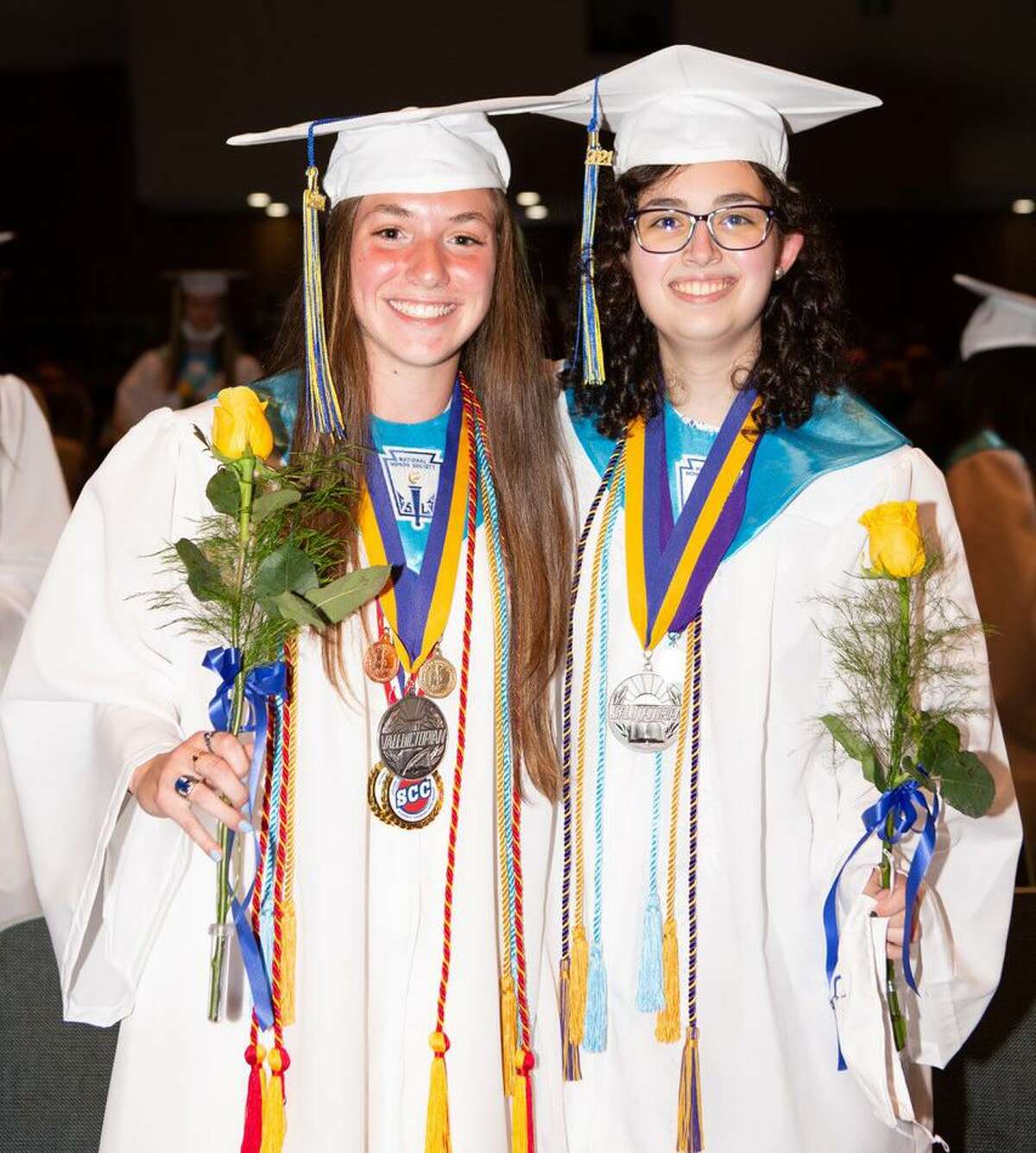 From left, Mercy High School valedictorian Kaila Lujambio and salutatorian Giuliana Judge pose for a photo during Sunday’s commencement.