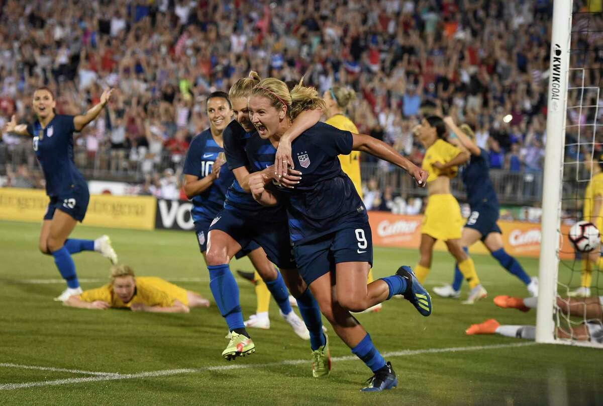 The United States’ Lindsey Horan (9) is hugged by teammate McCall Zerboni after scoring a goal during an international match against Australia in 2018 in East Hartford.