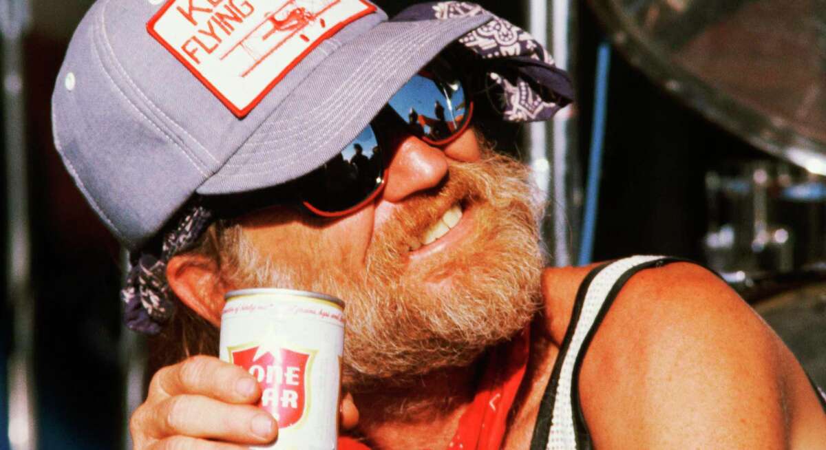 Willie Nelson with a can of Lone Star. In the 1970s, the country legend was instrumental in boosting the brand in exchange for free beer.
