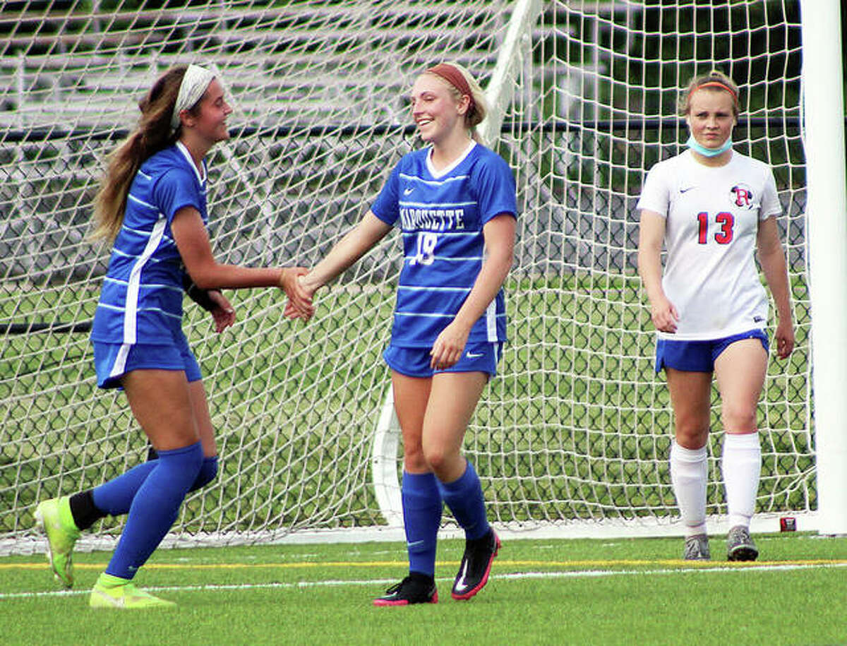 Emma Anselm, right, and teammate Jillian Nelson each scored a foal for Marquette Tuesday in its 4-0 victory over Waterloo Gibault at Gordon Moore Park. Teammate Hayley Williams scored the other two Marquette goals. Anselm and Nelson are shown during a game earlier this season against Roxana.