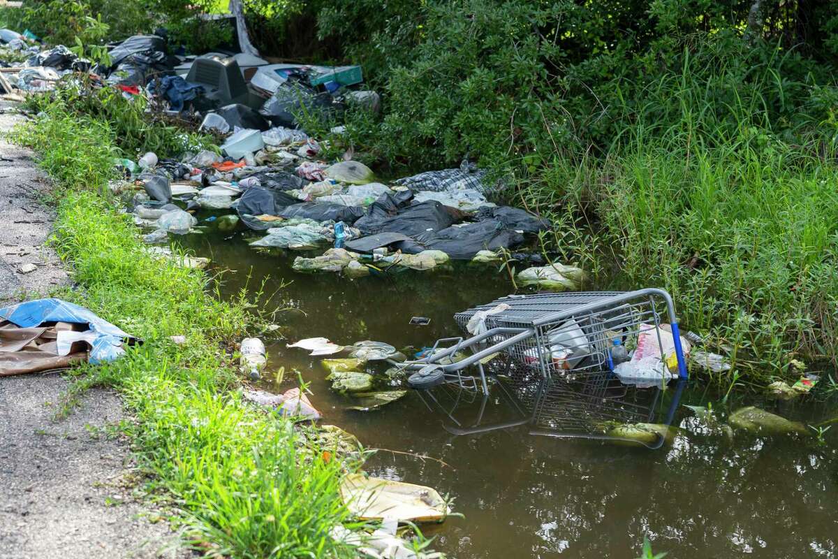 Illegallly dumped garbage clogs a drainage ditch in Fifth Ward. Houston’s City Council on Wednesday doubled the fine for those caught illicitly dumping trash and other junk, from $2,000 to $4,000.