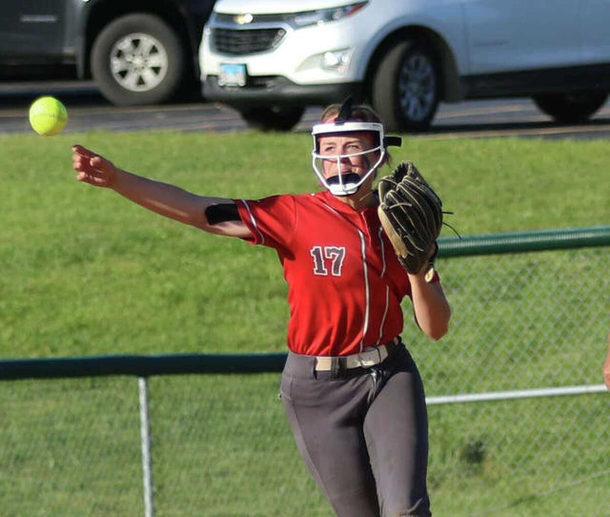 Alton shortstop Alissa Sauls throws to first for an out in a game earlier this month in Godfrey. The Redbirds were in Collinsville on Tuesday and lost a key SWC game to the Kahoks.