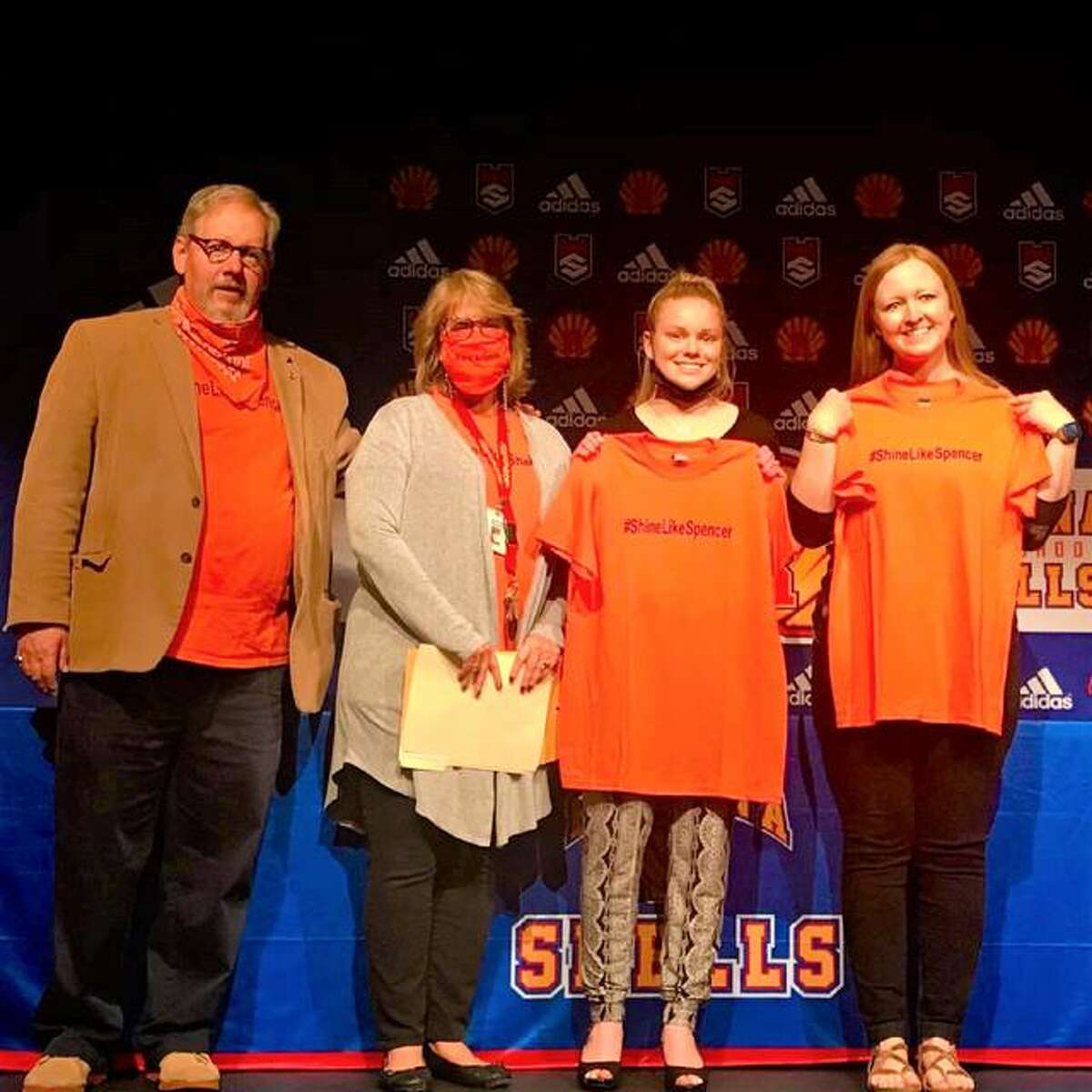 Left to right, Shine Like Spencer Kindness Award creators Mark Bacus and his wife, Debbie Bacus, stand with Roxana High School senior Emma Little and guidance counselor Jen Garrison, at the high school, as Little receives the $500 scholarship in the Bacuses’ late son Spencer Bacus’ name.