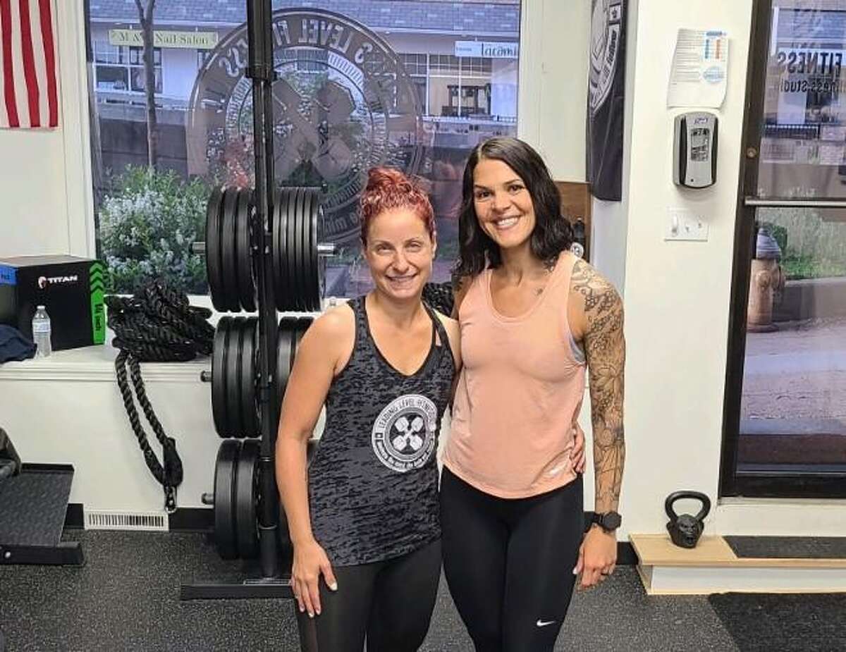 Jill Bodach, left, and Laurean Vazquez-Limauro, owner of Leading Level Fitness in Shelton, have organized a fundraiser Fairfield resident Charlie Capalbo, who is undergoing treatment for leukemia for a third time. The pair are asking people to commit to running 100 miles in May in honor of Capalbo, collecting pledges for each mile run in the process.