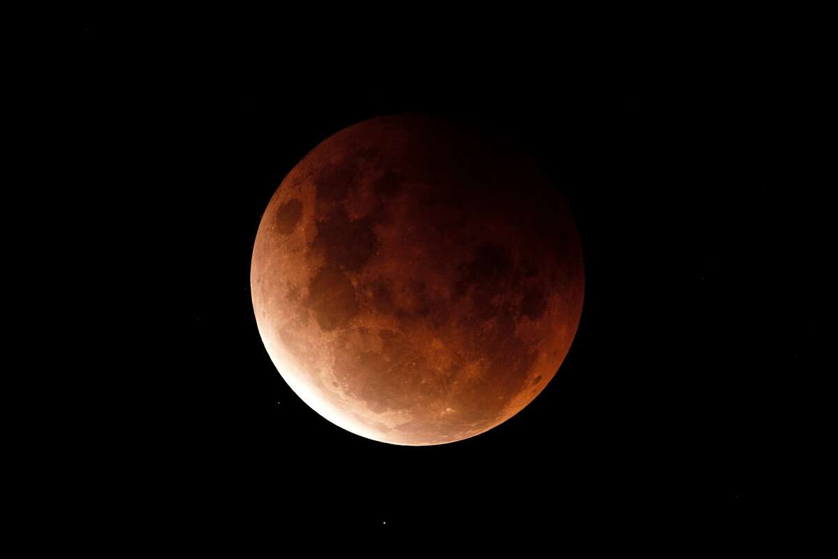 A super blood moon is seen during a total lunar eclipse on May 26, 2021 in Sydney, Australia. 