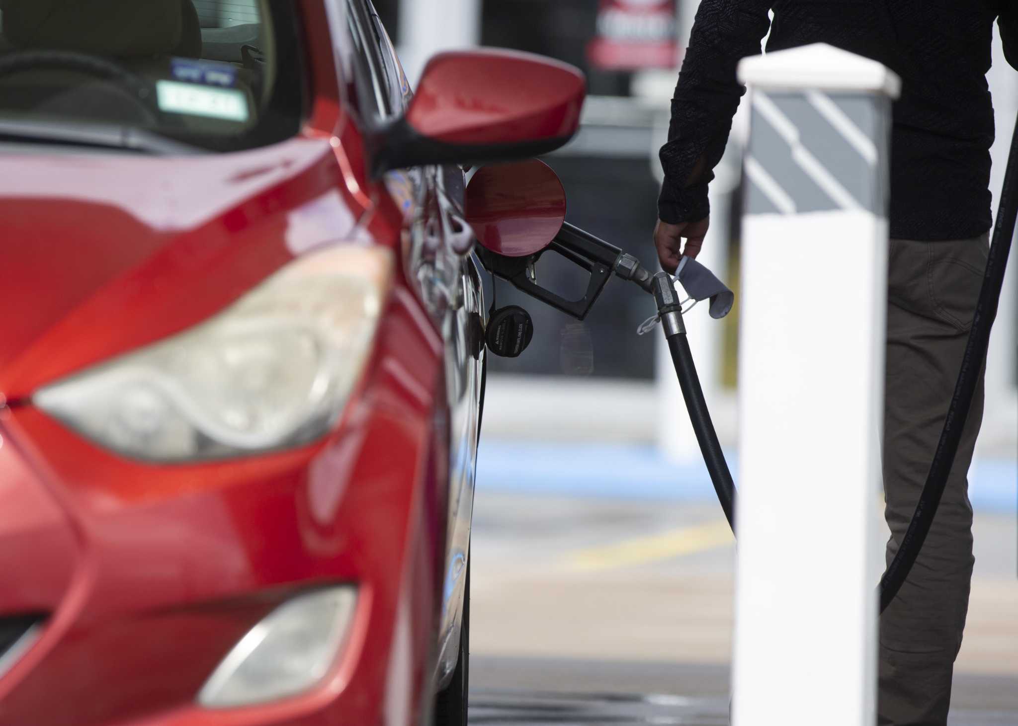 Gasoline prices slide in Houston, nation