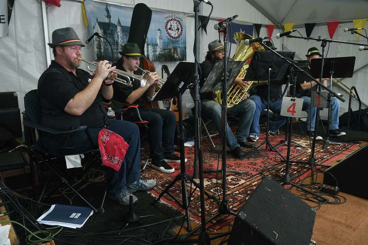 Mark Wootton, left, and his fellow members of the Home Brewed Brass Ensemble from Houston, perform during the Tomball German Heritage Festival at the Tomball Depot on March 30, 2019.
