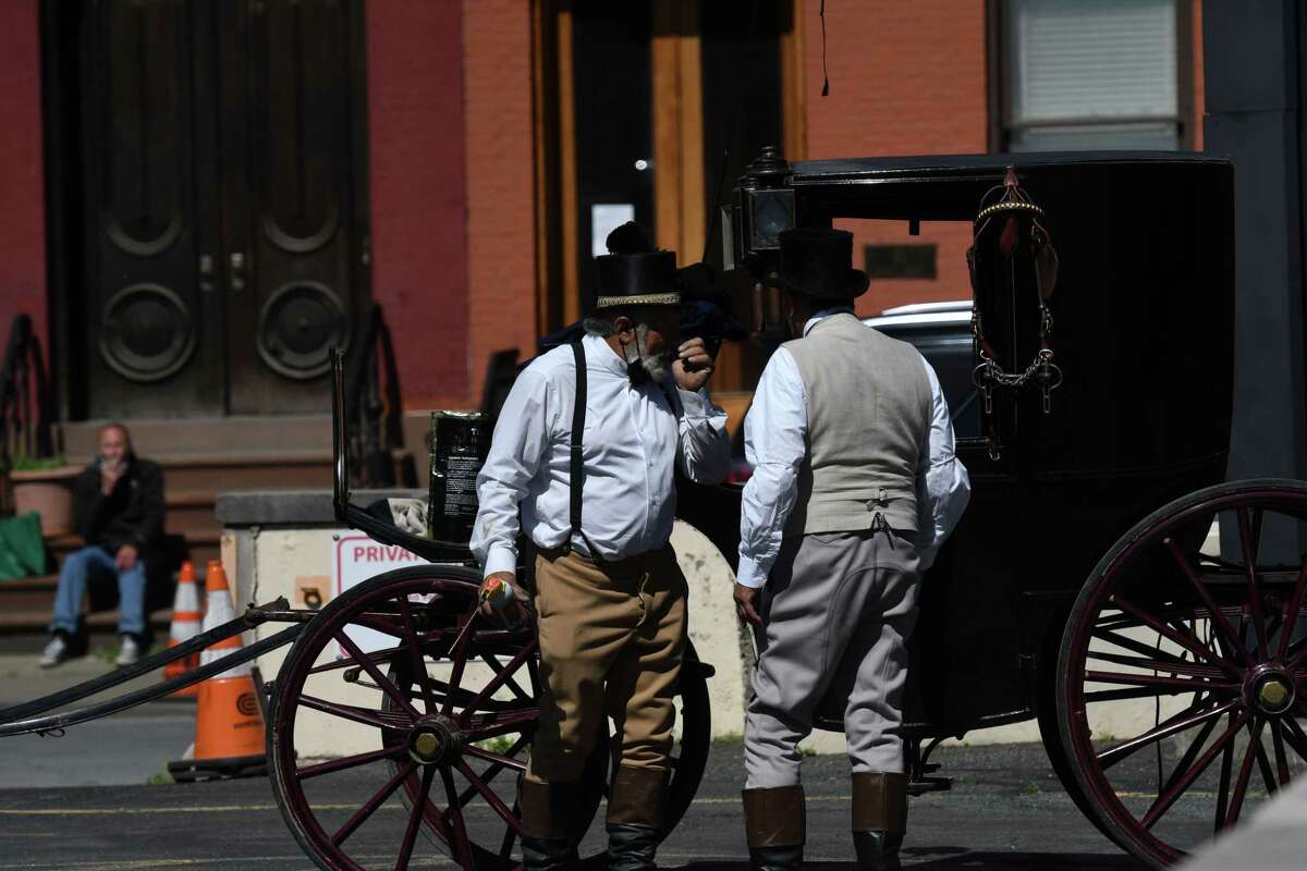 Horse drawn carriages are prepared for filming in the HBO series 'Gilded Age' on Thursday morning, May 27, 2021, in a parking lot across from Tory Music Hall in Troy, N.Y. (Will Waldron/Times Union)