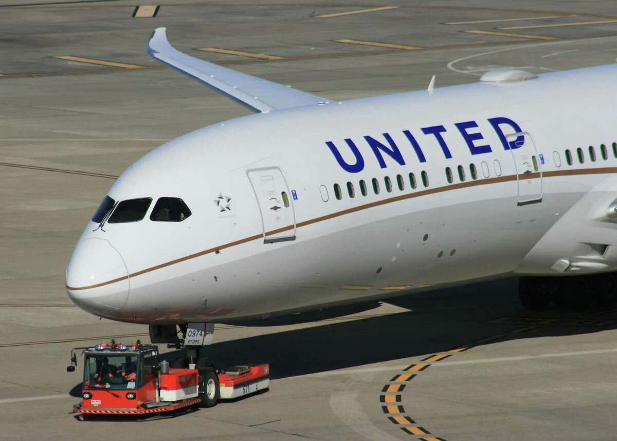 A United Airlines is towed to a gate at Bush Intercontinental Airport.