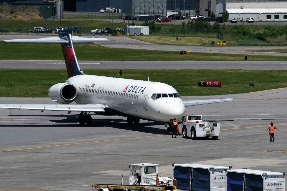 A Delta jet is pushed back from the gate at Albany International Airport on Thursday, May 27, 2021, in Colonie, N.Y. (Will Waldron/Times Union)