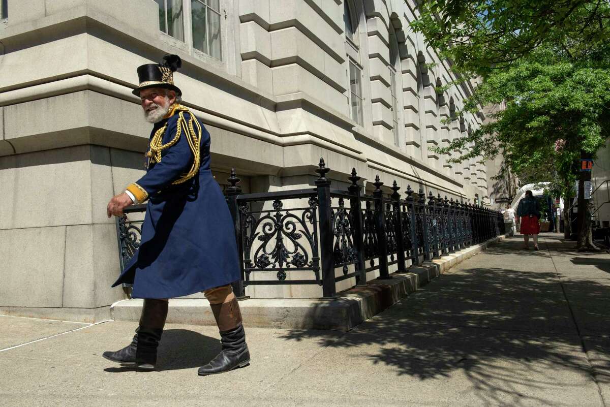 Actors and extras are seen walking around the corner of the Troy Savings Bank Music Hall during filming of The Gilded Age on Thursday, May 27, 2021 in Troy, N.Y. (Lori Van Buren/Times Union)