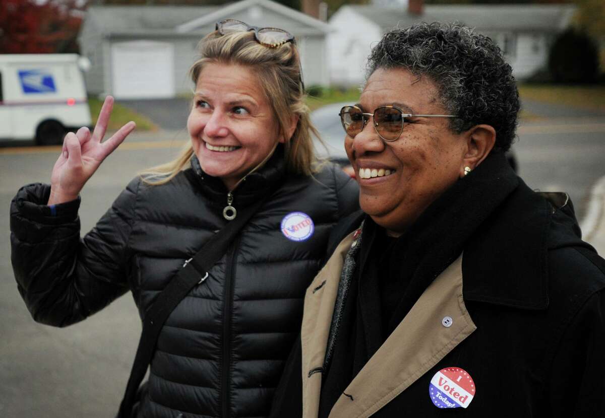 Voter Jennifer Budai, left, poses for a photo with Democratic Mayoral Candidate Stephanie Philips outside the Wooster Middle School polling place in Stratford, Conn. on Tuesday, November 7, 2017.