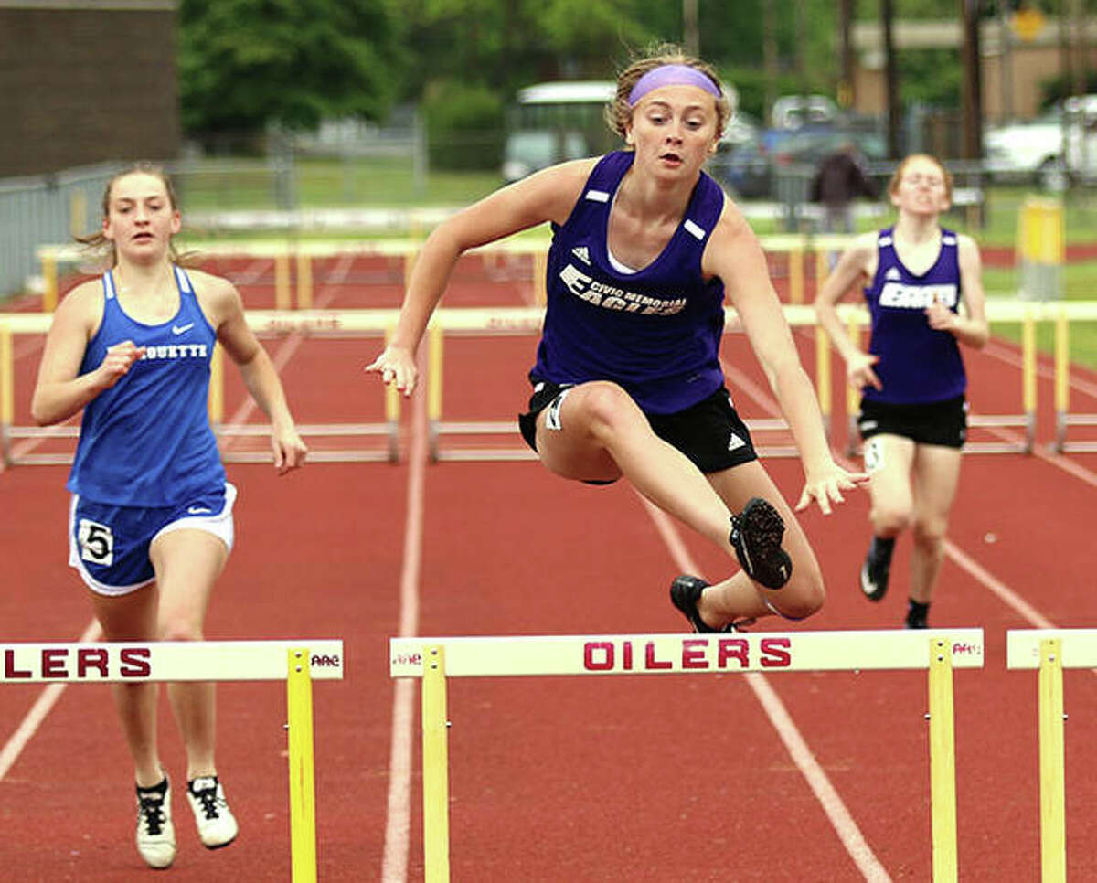 CM’s Bella Dugger (middle) clears the final hurdle in the 300-meter hurdles at the Madison County Meet May 17 in Wood River. On Thursday, Dugger won the 100 hurdles and was second in the 300 hurdles at the Mississippi Valley Conference girls track meet in Troy.