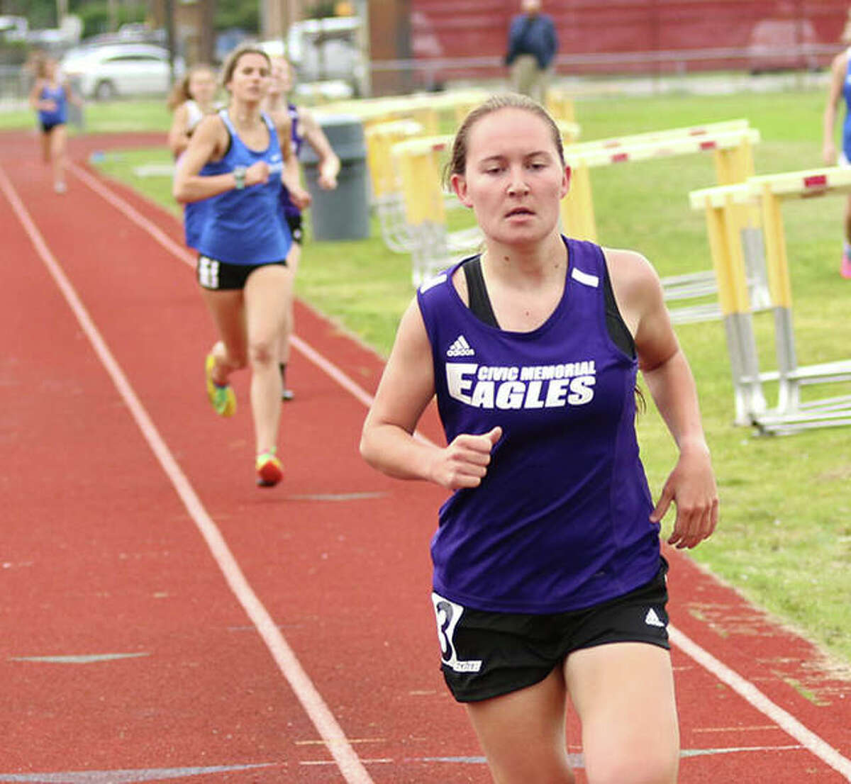 CM’s Hannah Meiser (front), shown running the 800 at the Madison County Meet on May 17 in Wood River, won the 1,600 and was runner-up in the 800 on Thursday at the MVC Meet in Troy.