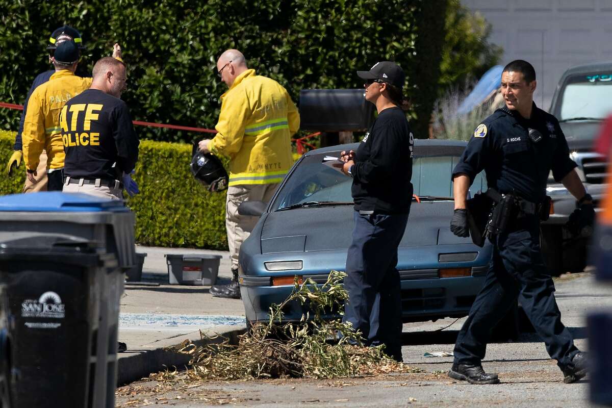 Alcohol, Tobacco and Firearms officers along with with San Jose fire and police officials outside the home of Samuel James Cassidy on Thursday after the mass shooting at a Valley Transportation Authority light-rail yard.