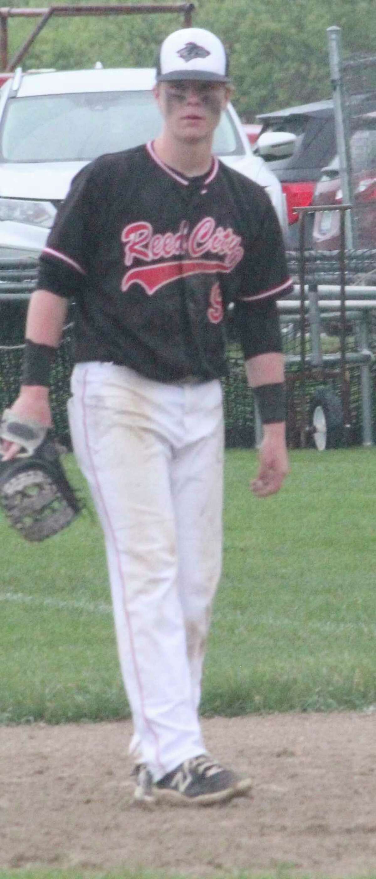 Reed CIty's Max Hammond focuses on the action at first base against Evart on Thursday. (Pioneer photo/John Raffel)