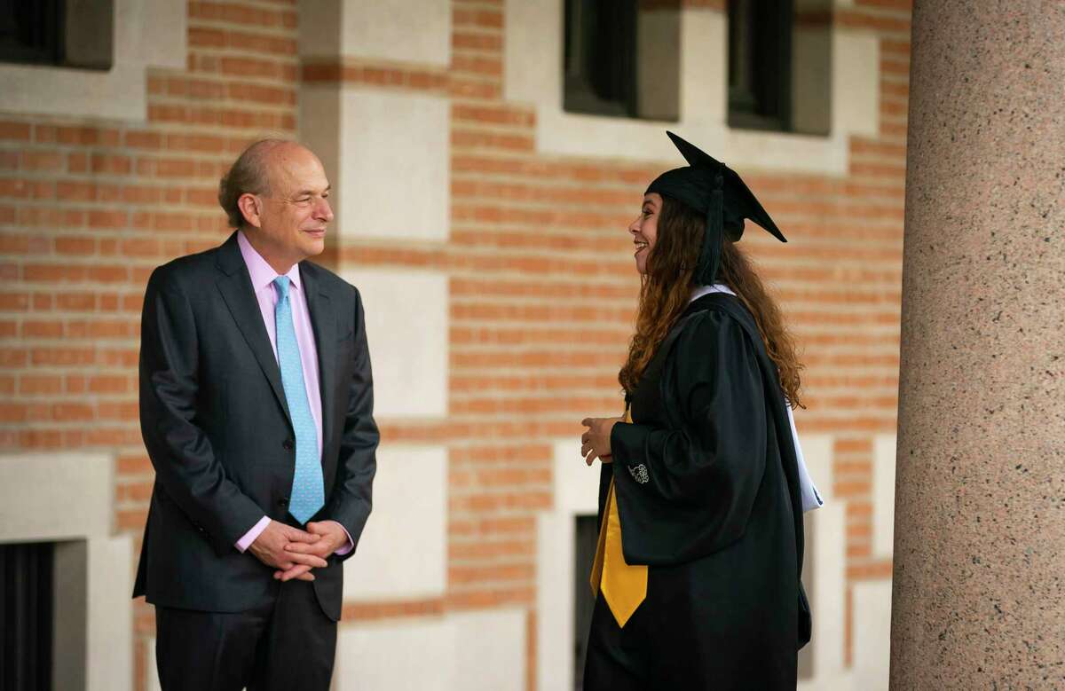 Rice University President David Leebron talks with recent graduate Citlali Villarreal, Wednesday, May 26, 2021, on the campus of Rice University in Houston. Villarreal, who just graduated with a degree in ecology and evolutionary biology, was on campus taking celebratory photos with her family when she ran across President Leebron. Leebron announced Wednesday that he will step down from his position in June 2022. His tenure at the college makes him the second-longest president following Rice’s founding president, Edgar Odell Lovett, who held the position for 34 years.