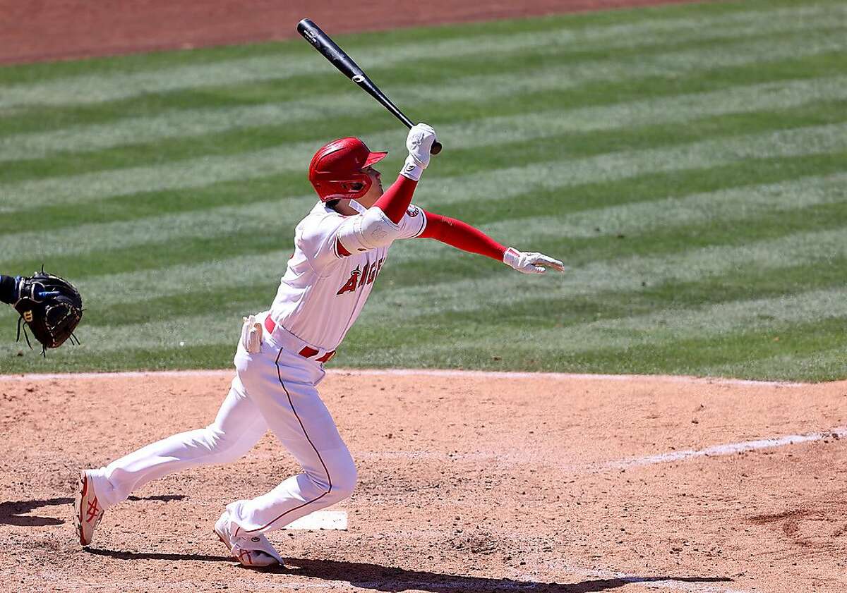 ANAHEIM, CALIFORNIA - MAY 26: Shohei Ohtani #17 of the Los Angeles Angels runs to first on an infield single during the sixth inning of a game against the Texas Rangers at Angel Stadium of Anaheim on May 26, 2021 in Anaheim, California. (Photo by Sean M. Haffey/Getty Images)