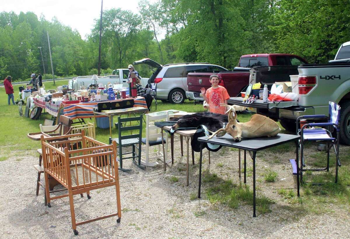 Vendors set up at the Paris Farmers Market on opening day Thursday with gently used items for resale along with original handmade items, produce and food products. (Pioneer photo/Cathie Crew)