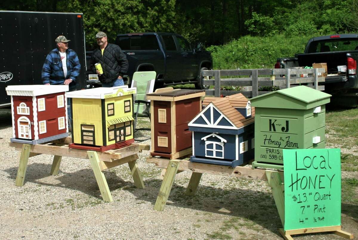 The Paris Farmers Market offers these handmade decorative beehives, as well as local harvested honey for sale. (Pioneer photo/Cathie Crew)