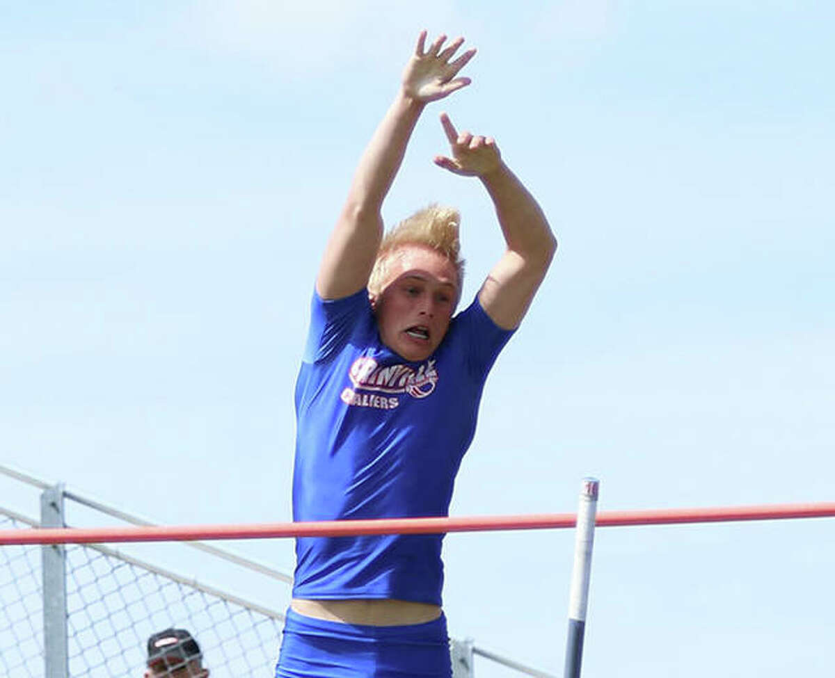 Carlinville’s Dustin Roberts releases the pole and clears the bar in the pole vault in the 2019 South Central Conference track meet at Hillsboro. Roberts finished third as a sophomore and came back Thursday as a senior to win the pole vault at the SCC Meet in Pana.