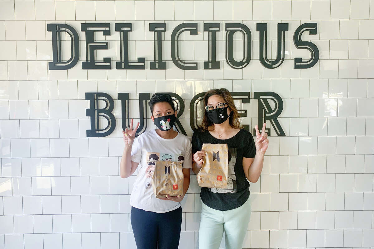 Judieann Ang, left, and Valerie Villaraza-Steele, right, went to a McDonald's in Alameda on Wednesday, March 26, 2021, to purchase a limited-time offer BTS meal.