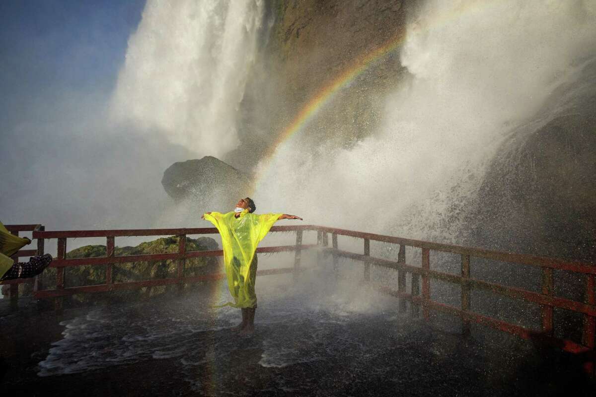 A visitor taking in the crashing water on the “Hurricane Deck” at the base of the Bridal Veil Falls, in Niagara Falls, N.Y., on July 26, 2020. "This is the moment to step back, be intentional and ask: What’s really important, and how should I focus on what matters," writes The New York Times opinion columnist David Brooks. (Damon Winter/The New York Times)