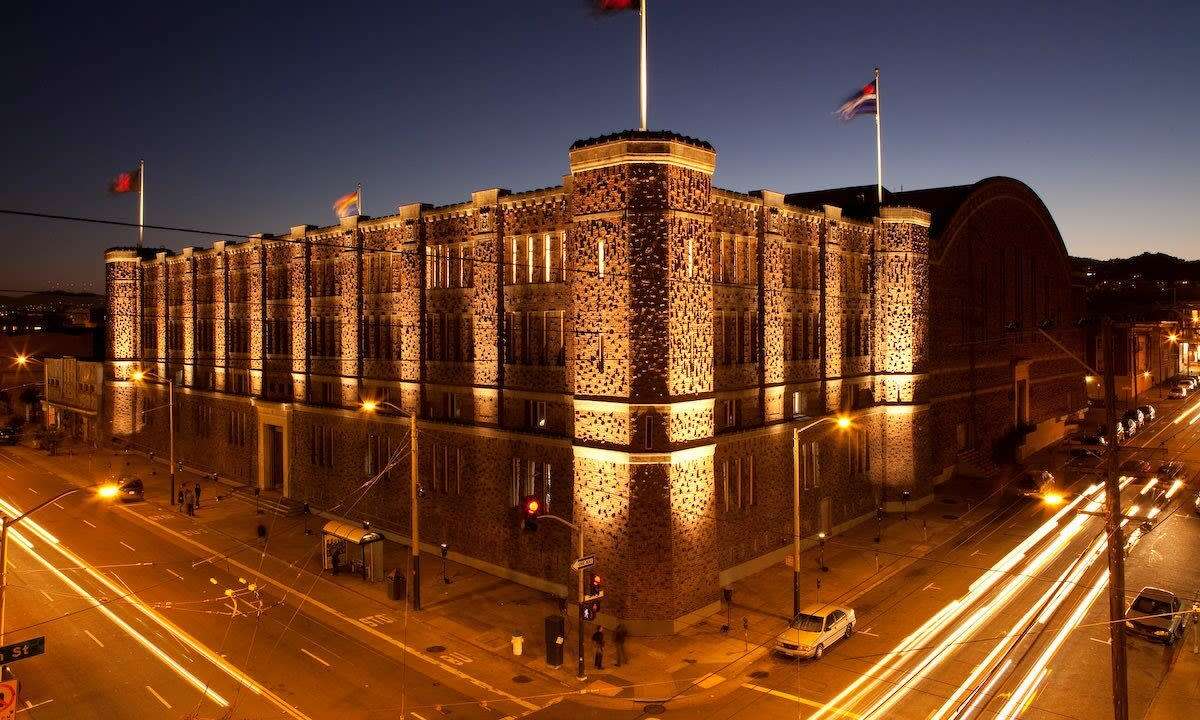 The exterior of the Armory, with the kink flag flying.