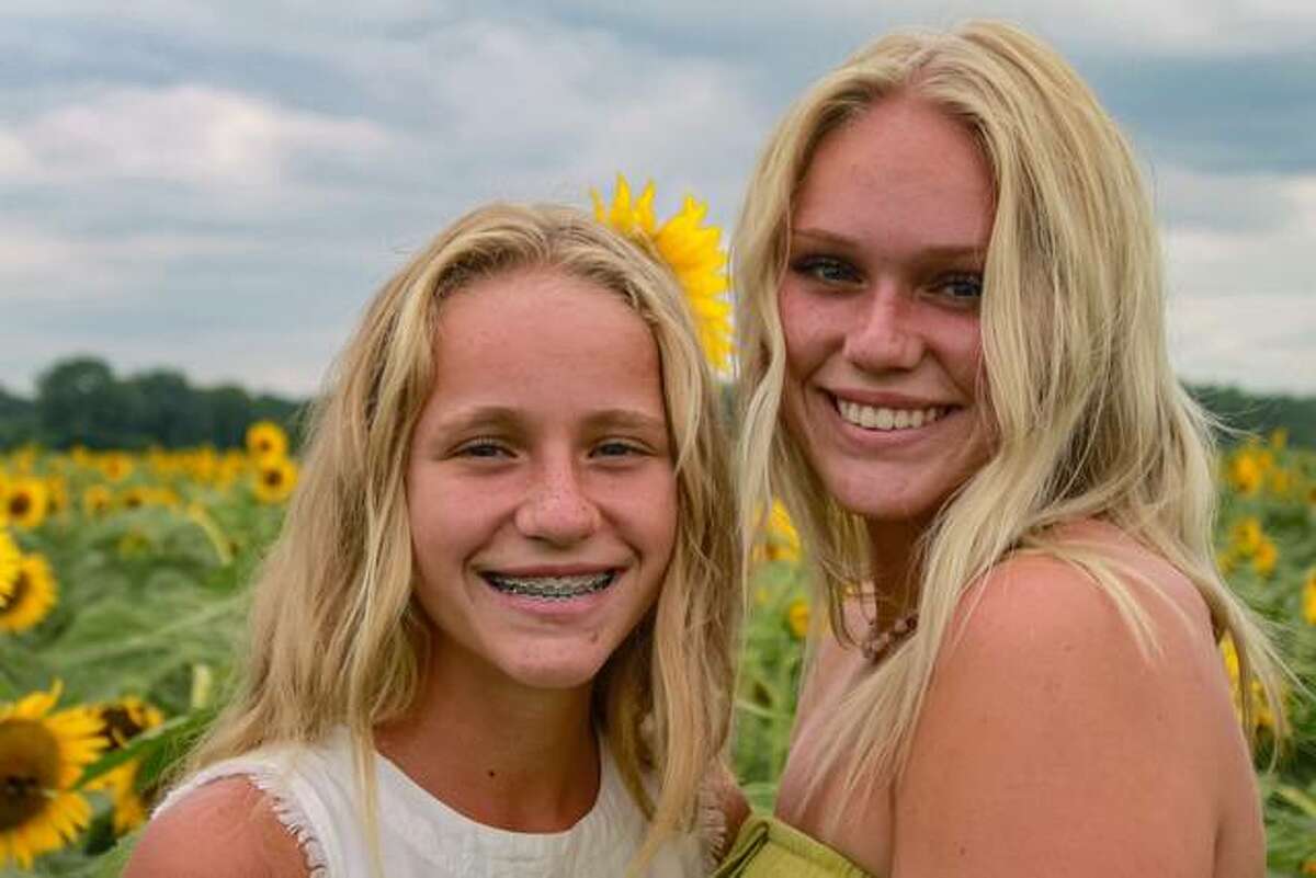 Sisters Lily Freer, left, and Taylor Freer will host their 13th Christmas in July event Friday, July 30, at Freer Auto Body, 4512 N. Alby St., in Godfrey. The event kickstarts Community Christmas, sponsored by The Telegraph and the United Way.