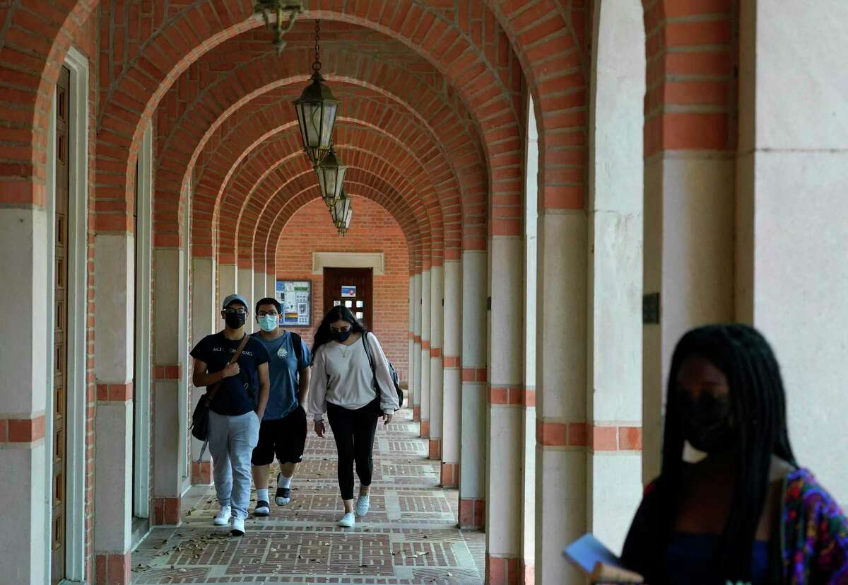People walk into the Rice Memorial Center at Rice University Thursday, April 1, 2021 in Houston. 