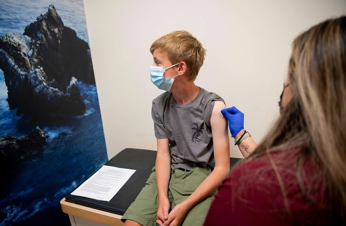 Ryan Youngberg, 12, receives a dose of a Covid-19 vaccine at Tamalpais Pediatrics in Larkspur, California on May 26, 2021.