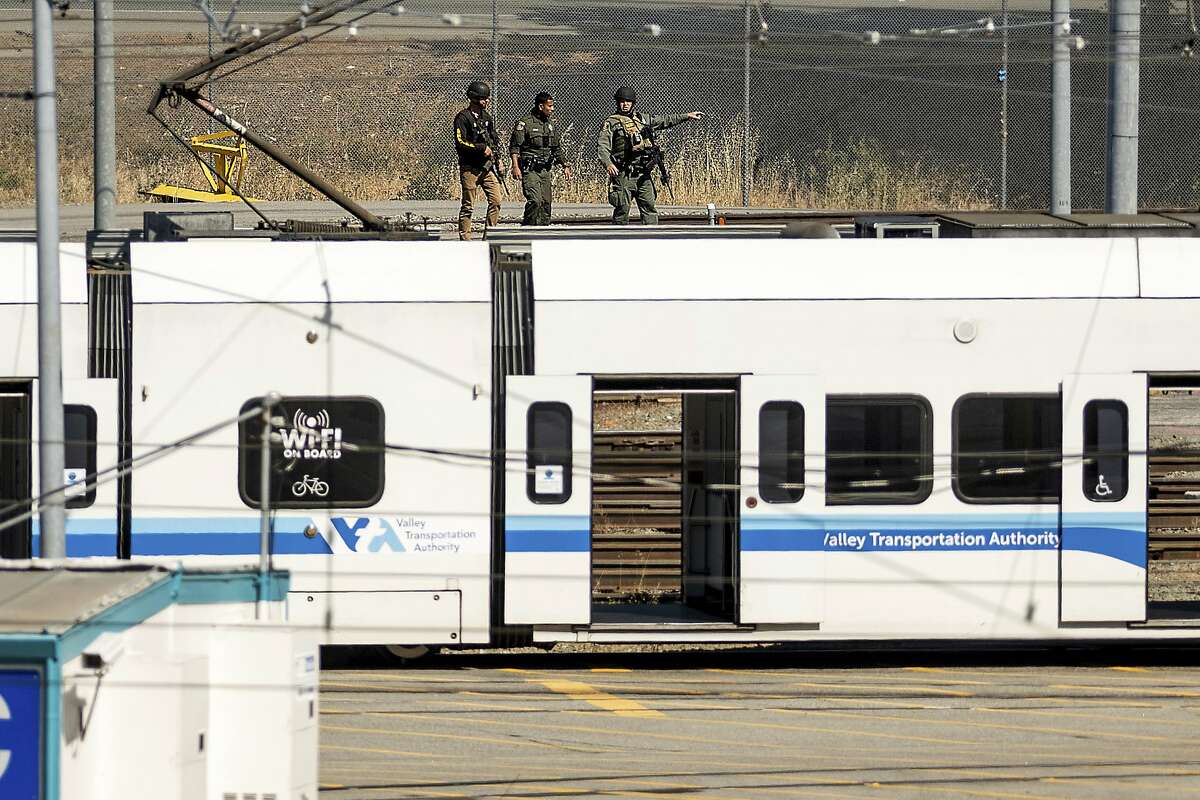 Law enforcement officers respond to a Santa Clara Valley Transportation Authority light-rail yard in San Jose, where a gunman opened fire and killed nine employees Wednesday before turning the weapon on himself.