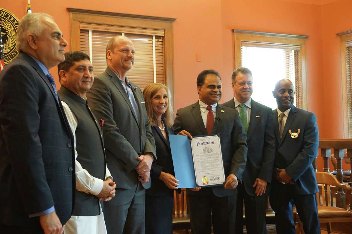 Dr. Asim Shah, executive vice-chair and professor of psychiatry and family and community medicine at Baylor College of Medicine, from left, Honorary Consul General of Pakistan Abrar Hashmi, Fort Bend County Commissioner Ken DeMerchant, Dr. Connie Almeida, director of the Fort Bend County behavioral health services department, Fort Bend County Judge KP George, Honorary Consul General of Portugal Jose M. Ivo and Fort Bend County Sheriff Eric Fagan pose during a recognition ceremony on Friday, May 28, at the Fort Bend County Historic Courthouse in Richmond. The event honored Shah and Almeida’s work in mental health.