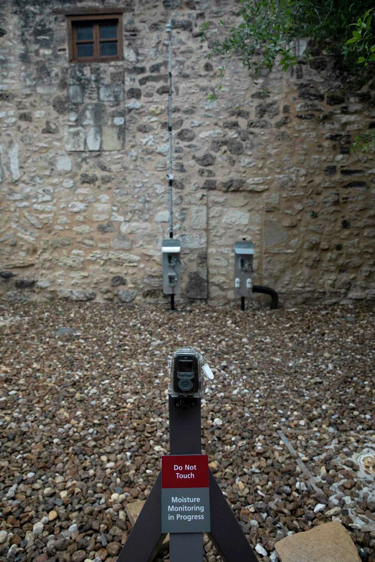 A waterproof, time-lapse camera is set up outside the Alamo Church to record the speed rainfall and other moisture from a wall channels, pools and eventually dries. The camera, along with moisture-monitoring units, will be in place for a year to study temperatures moisture in the limestone walls and how best to proceed with preservation and conservation techniques.