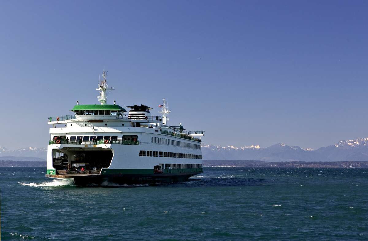 Ferry returning to port with Olympic Mountains on the horizon.