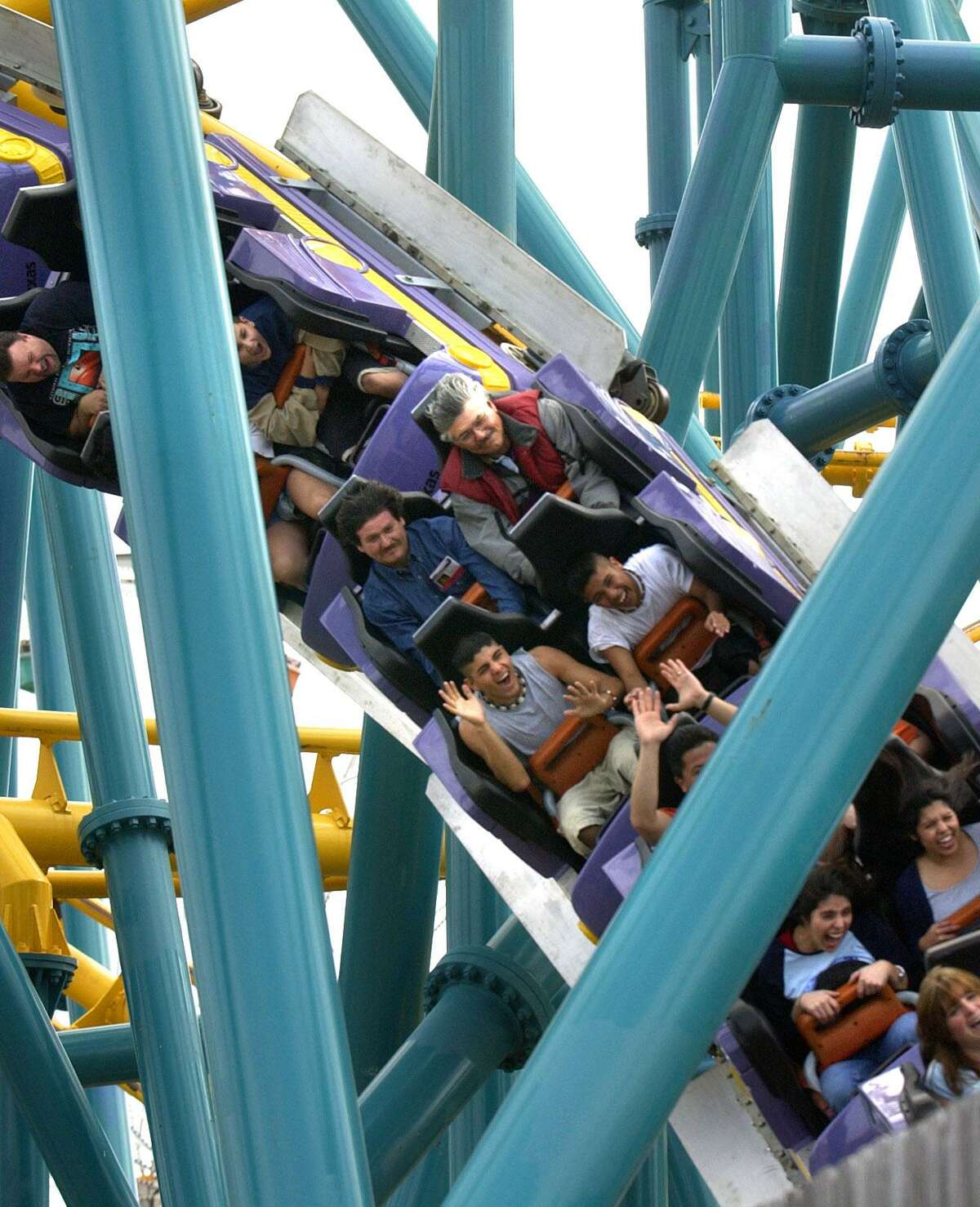 People ride the Poltergeist roller coaster in this 2003 photo.