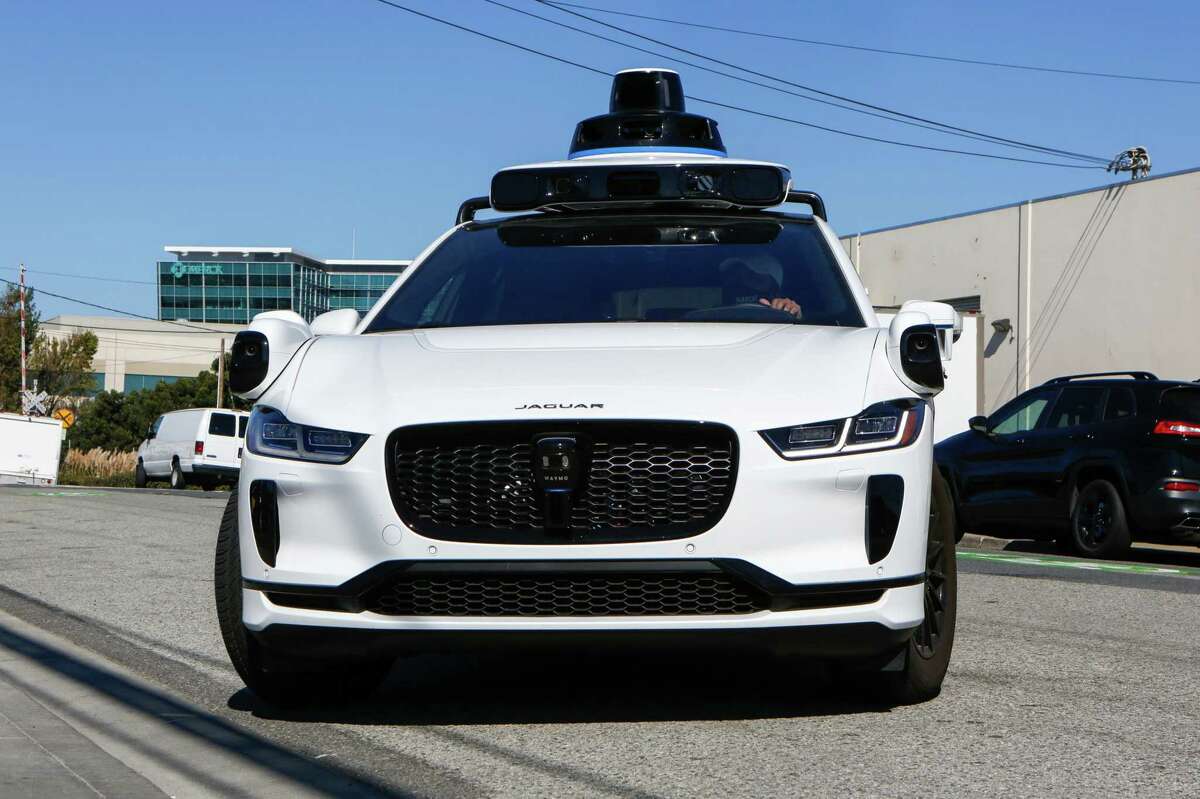 Waymo Jaguar I-Pace car arrives at its temporary location in 2020 in South San Francisco. Waymo is launching a pilot program in San Francisco using autonomous vehicles.