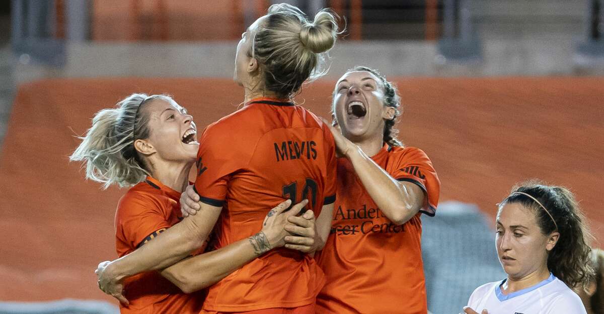 Houston Dash midfielder Kristie Mewis (19), center, celebrates with Houston Dash forward Rachel Daly (3), left, and Houston Dash midfielder Gabby Seiler (5), right, celebrate Mewis's second half goal that gave the Dash a 2-1 lead during a game between the Houston Dash and the Chicago Red Stars on Saturday, May 29, 2021, at BBVA Stadium in Houston.