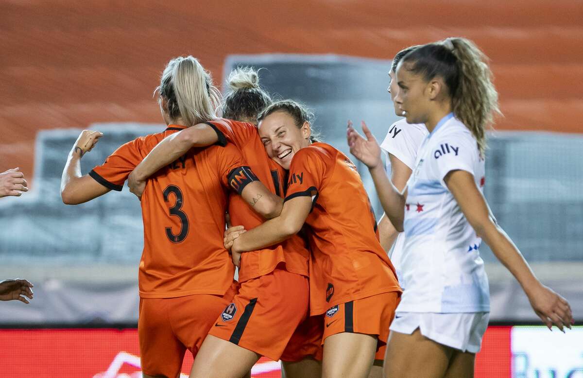 Houston Dash midfielder Kristie Mewis (19), center, celebrates with Houston Dash forward Rachel Daly (3), left, and Houston Dash midfielder Gabby Seiler (5), right, celebrate Mewis's second half goal that gave the Dash a 2-1 lead during a game between the Houston Dash and the Chicago Red Stars on Saturday, May 29, 2021, at BBVA Stadium in Houston.