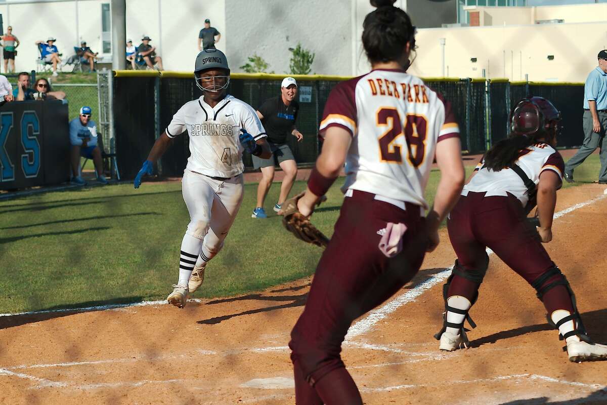 Clear Springs?• Emma King (4) crosses home plate to score a run against Deer Park Saturday, May 29 at Shadow Creek High School.