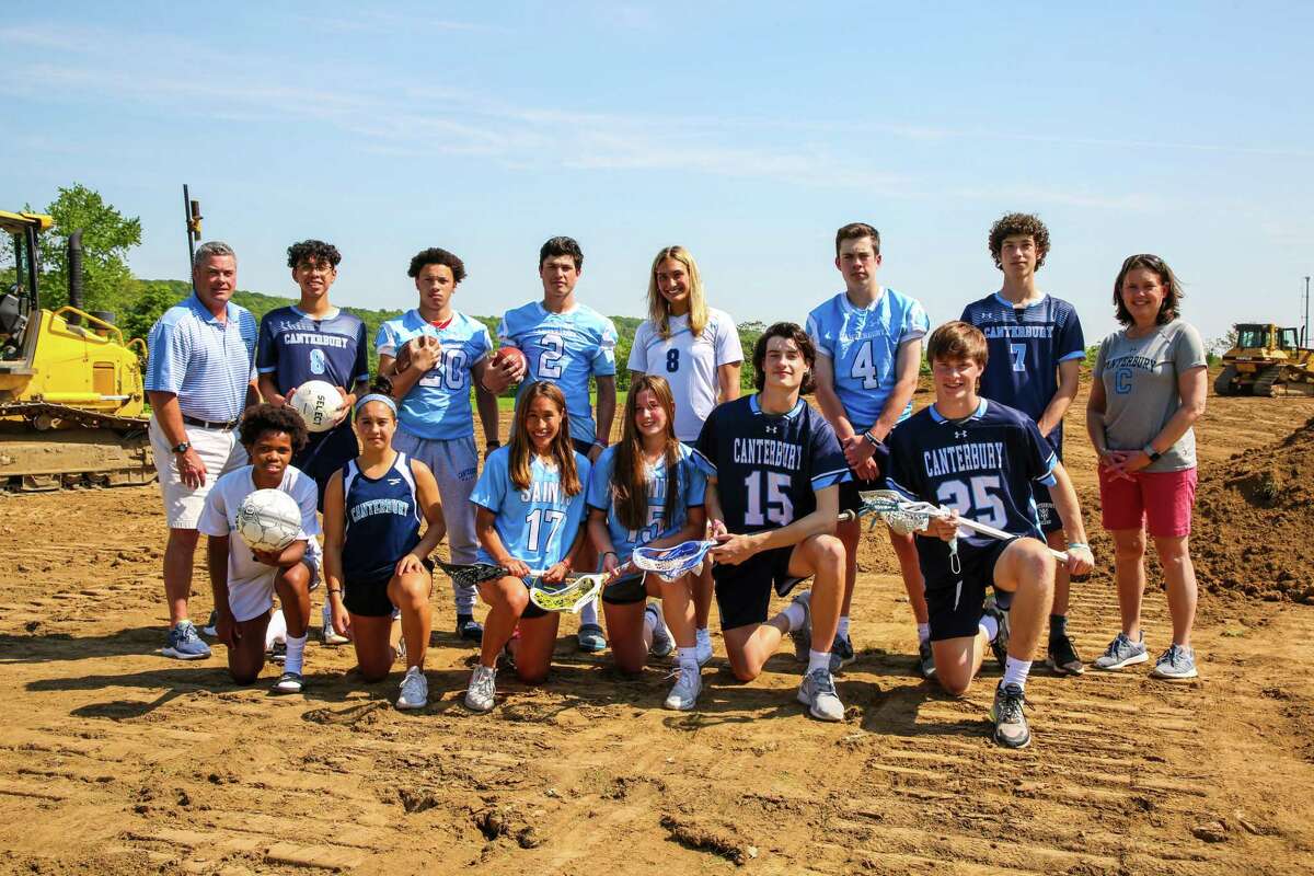Canterbury School student-athletes gathered with Head of School Rachel Stone (far right) and Director of Athletics and Head Football Coach Jim Stone (far left) to mark the start of construction for the school's new turf and stadium complex, scheduled for completion in the fall.